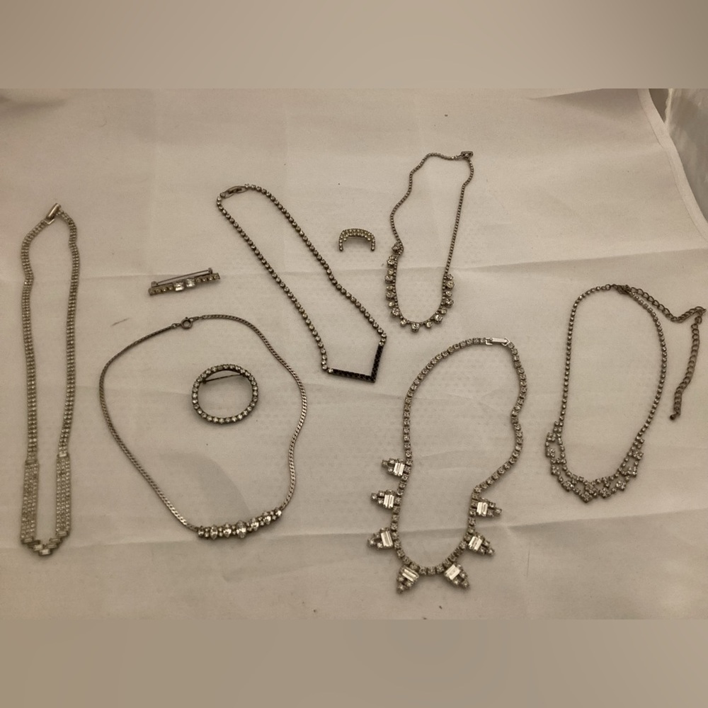 Shiny necklaces and brooches lot
